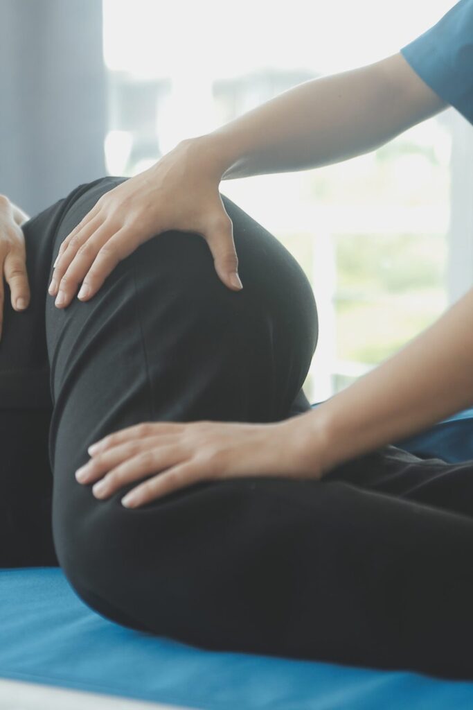 Senior woman doing exercises for knee osteoarthritis at home