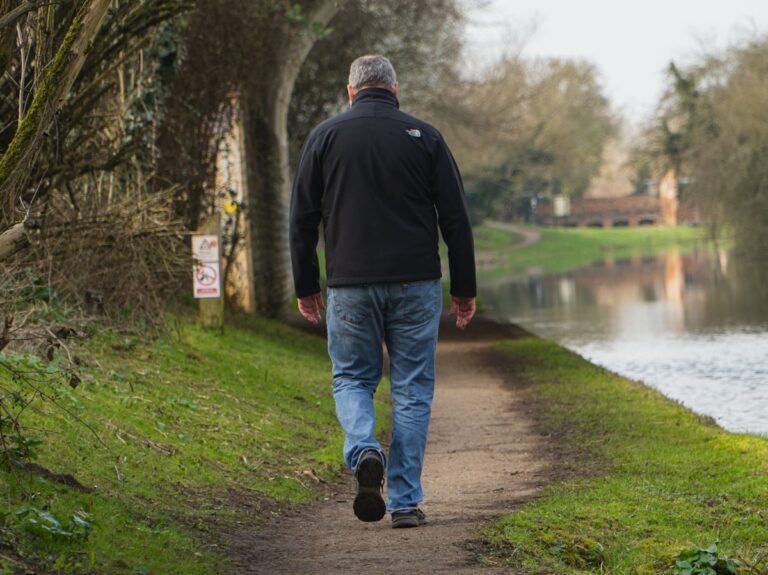 Older adult walking outdoors, staying active with non-surgical hip osteoarthritis treatment in Riverdale, GA