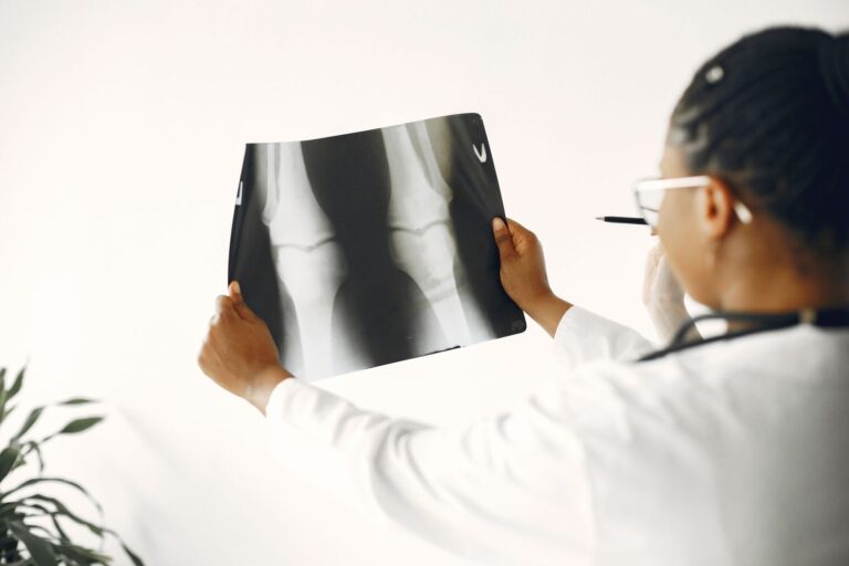 Clinician reviewing a knee X-ray before a knee arthrogram at Regenerative Joint Clinics in Riverdale, GA